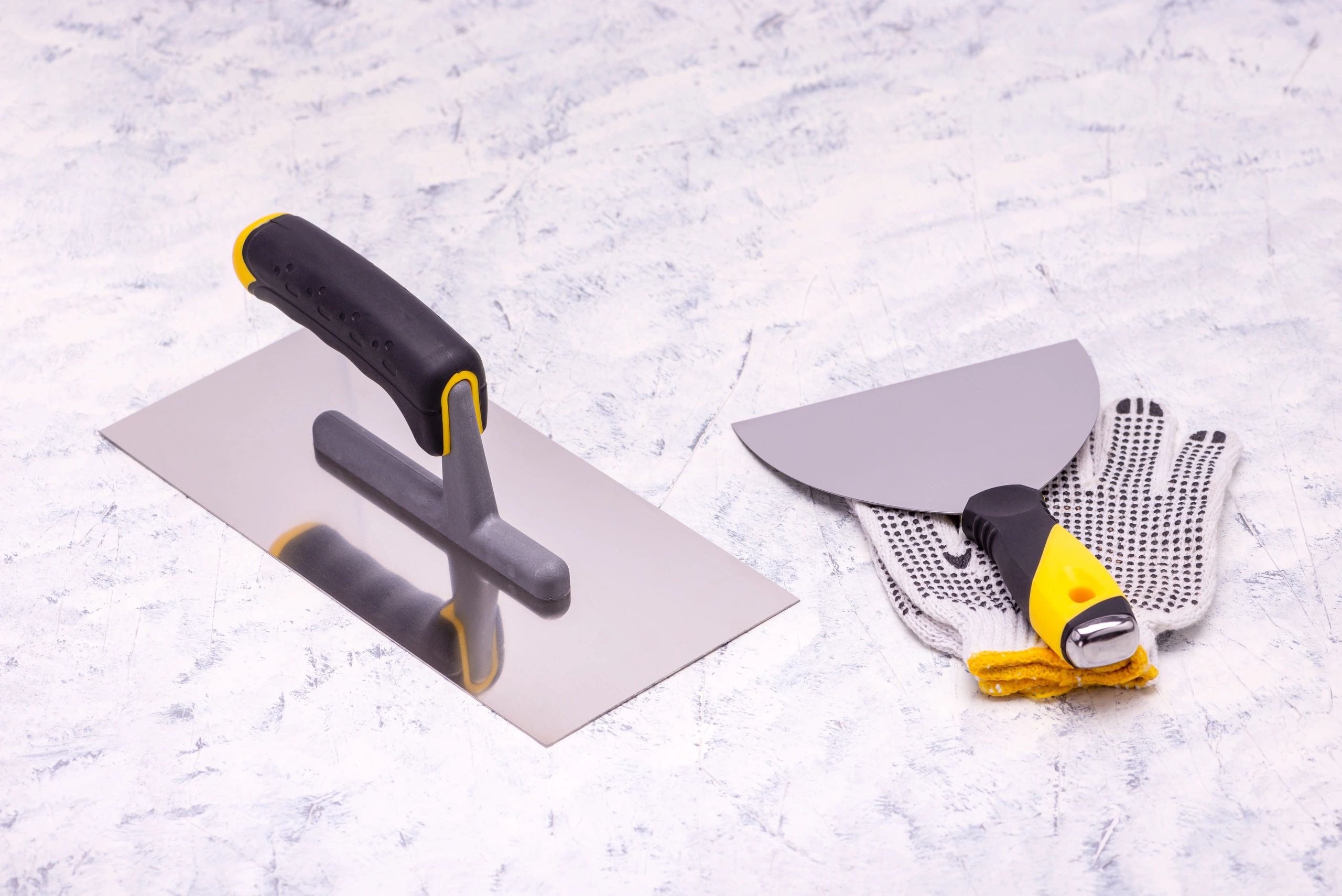 Drywall repair and plastering tools laid out